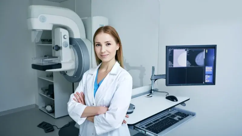 A female doctor with medical monitoring equipment in a hospital