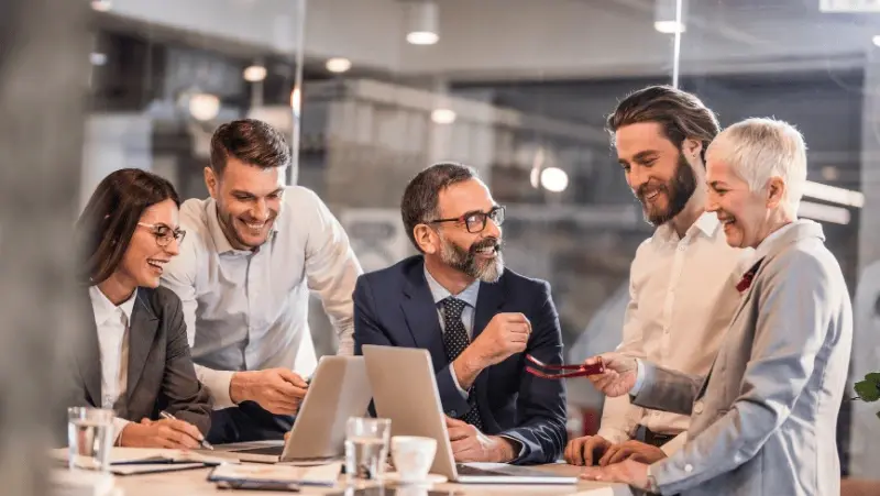 A group of people discussing business matters