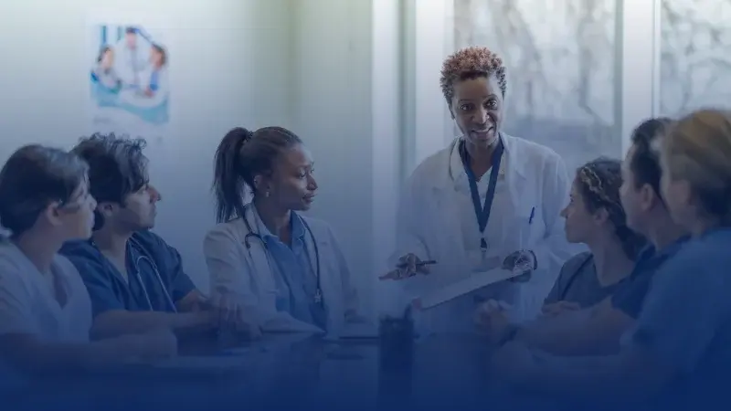 7 Doctors on a meeting room discussing medical matters