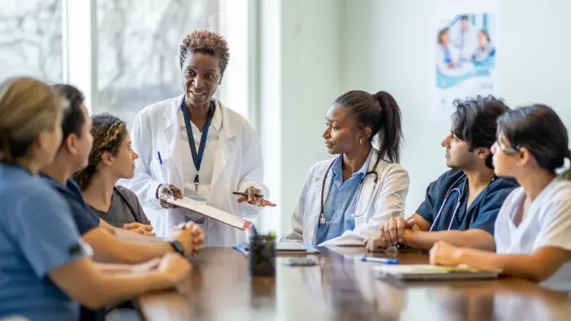 Doctors and nurses on a meeting room discussing 